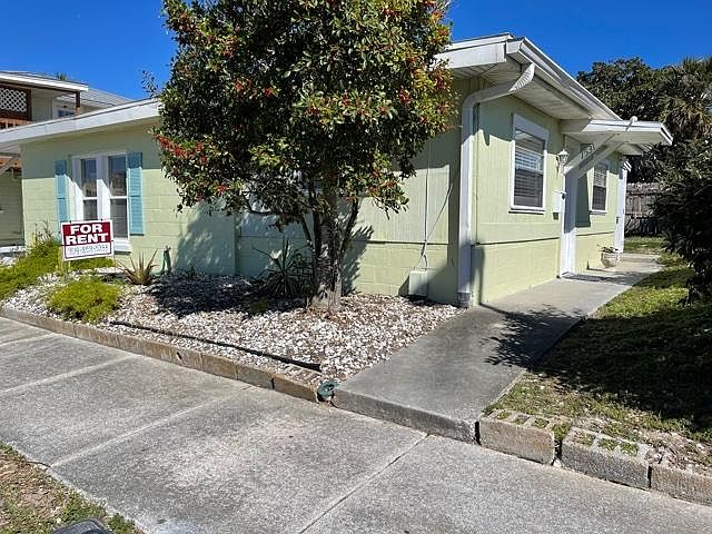 Front and side of building. Private walkway to front door.