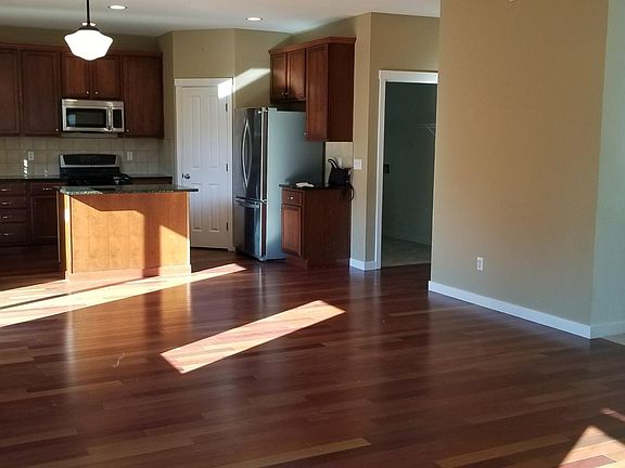 Kitchen with SS appliances, granite countertop and pantry