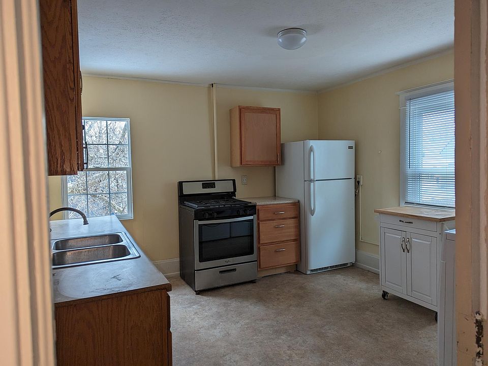 Kitchen with microwave, dishwasher, garbage dispose-all, front load washer and dryer, over sink bluetooth speakers
