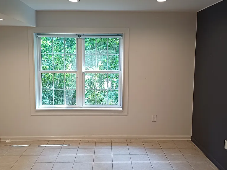 16'x16' basement den off of family room with separate entrance from outdoors. Ideal for an office, media center/guest room, or extra bedroom.