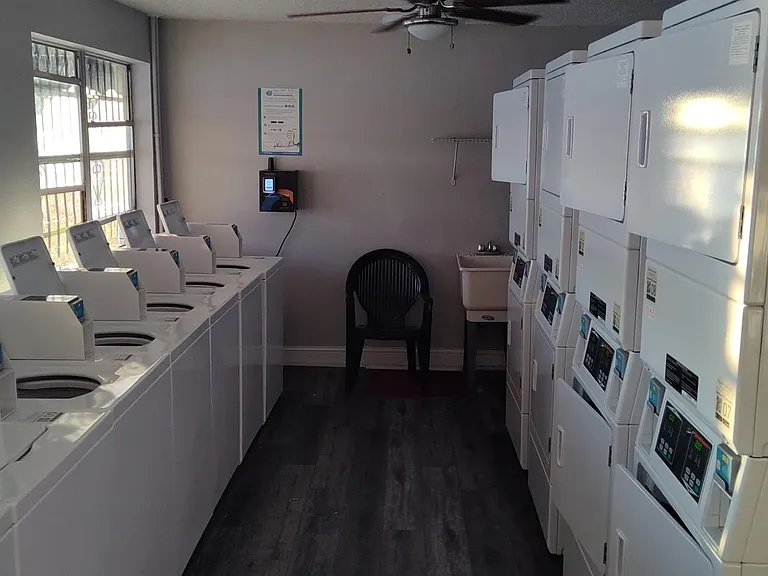Clubhouse laundry room. Faces the lake and uses credit cards.