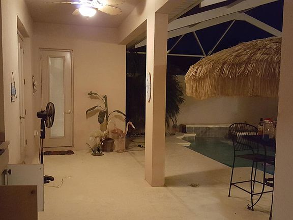 Mother-in-law suite has a full bathroom access from the pool. Also included is an electric grill with exhaust
