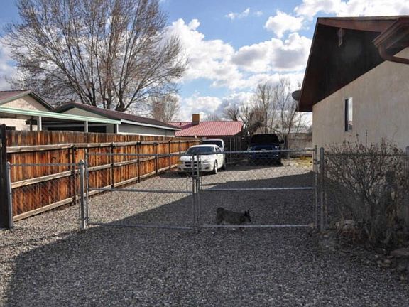 Side of house w/ carport