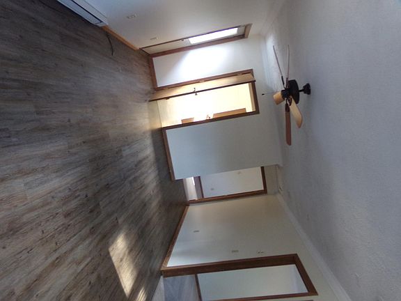 living room with fan door to balcony