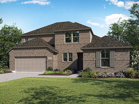 A two-story brick house with a garage, surrounded by a well-manicured lawn and lush greenery, set ag