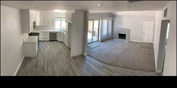Kitchen, Dining Room and Living Room with double pane windows and slider. Retitled modern fireplace.