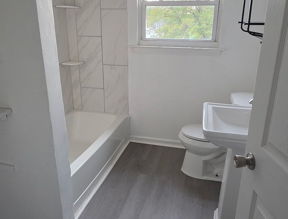 Bathroom with newly tiled bathtub/shower