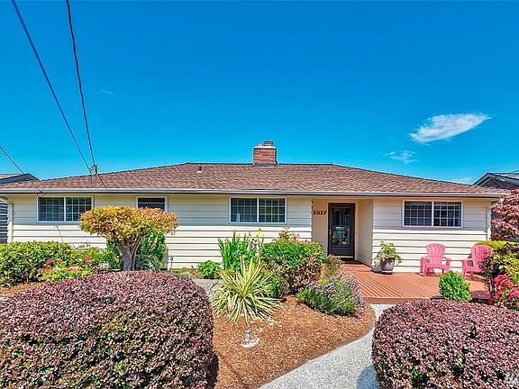 Welcome home to your beautifully-landscaped front yard