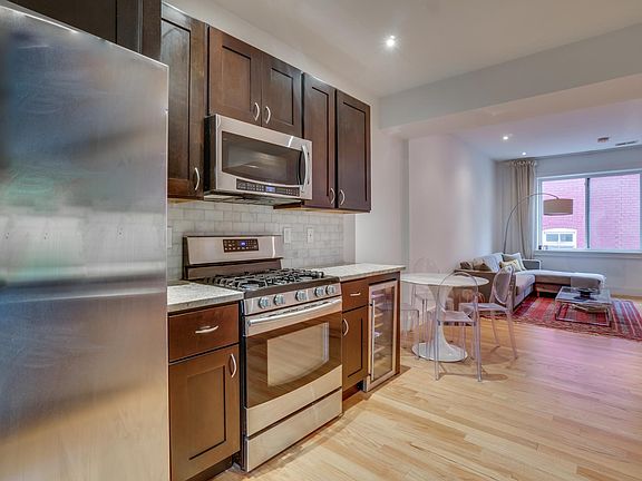 Bright Open-Concept Living Room with Hardwood Floors