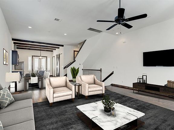 Another look at the enormous second floor virtually staged living space, which can also have a full sized dining table and chairs.