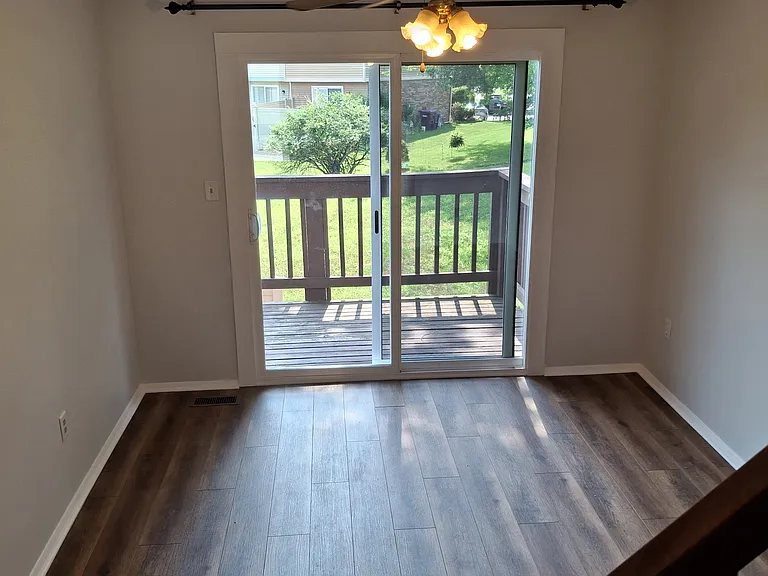 Dining Room with Sliding Door access to deck overlooking yard. Beautiful sunsets!