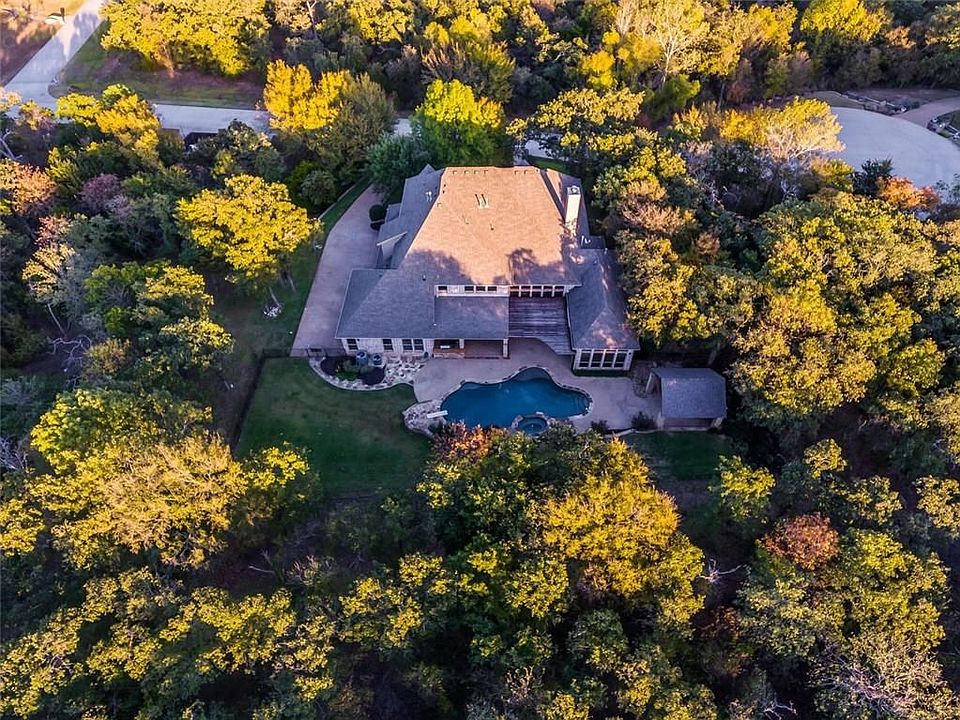 Sprawling 1+ acre estate nestled in the trees!