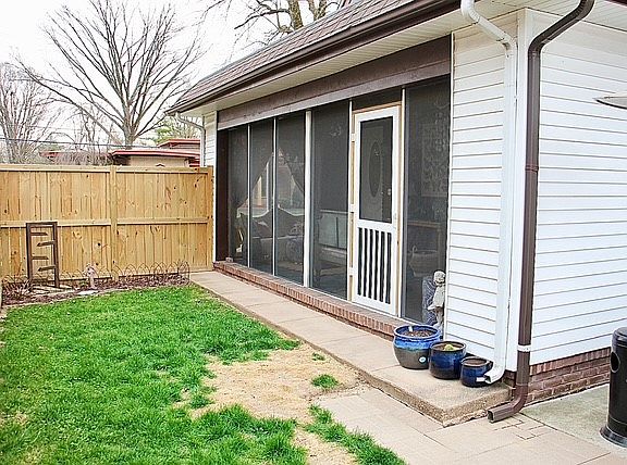 Backyard - fence has been painted since photo. Access to rear gate to behind house.