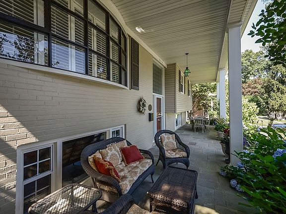 Entry features expansive flagstone patio