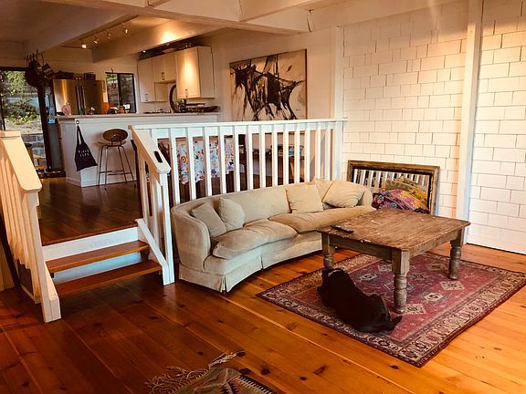 Living room, separate dining area, kitchen and door to backyard