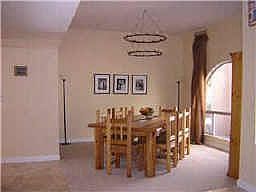 This great open floorplan has a formal dining room with plenty of room for entertaining. Current log pole custom table is 50x98. Accented by 10' ceiling and new Berber carpet with Travertine in the high traffic areas. Open and airy.