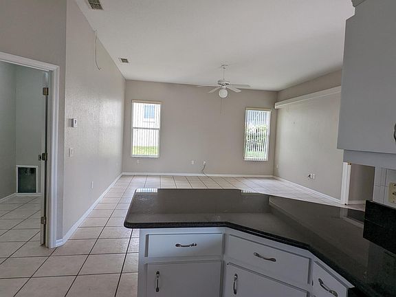 Looking towards Living Room (Laundry Room on the left) from Kitchen