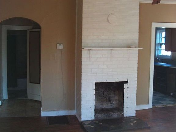 The Livingroom Fireplace View Into Kit & Bath