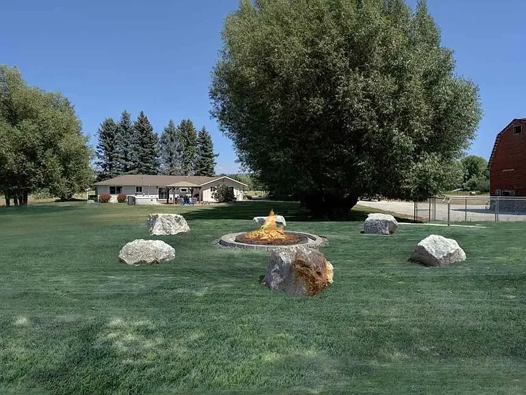 Fire pit off corner of property. Currently needs weed whacking before looking like this again :) Just in time for fall!