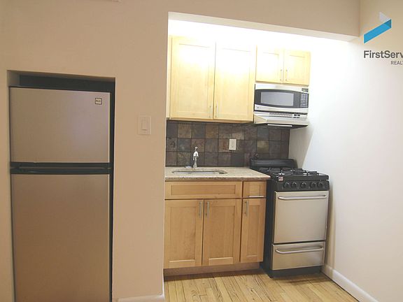 5th image of 303 E 12th St APT 1A