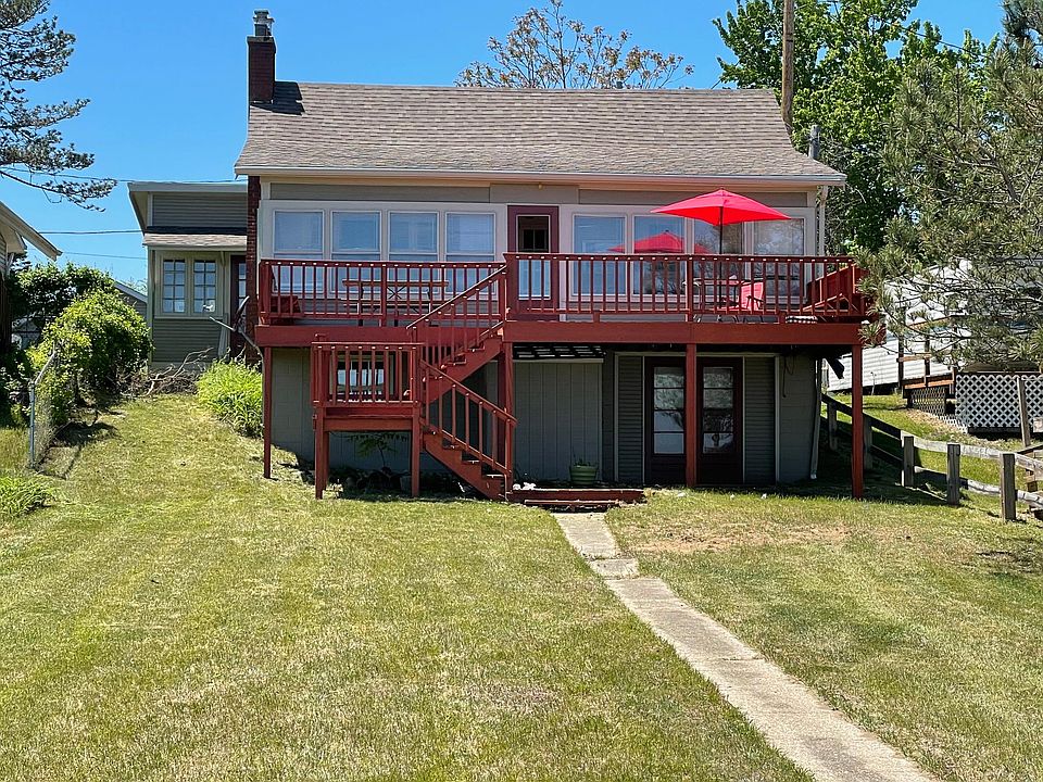Outside of house from the lakeside. Note walkout basement.