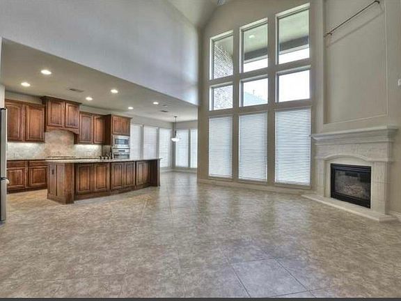 Open kitchen with walk in pantry, living area with floor to ceiling windows. Breakfast area and formal dining room!