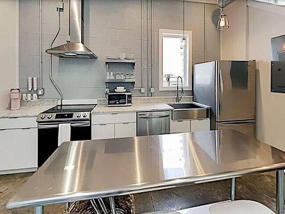 Kitchen - complete with coffee bar and dishes and pots and pans for all of your cooking needs