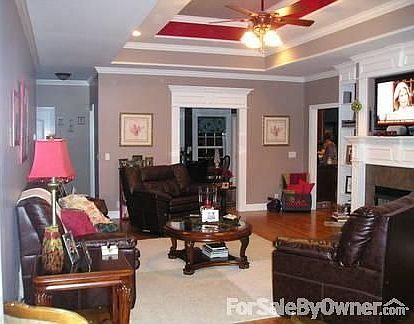 Living room, standing at the front door : Double trey, makes it 11 ft. ceiling. Ceiling fan. Re-cess