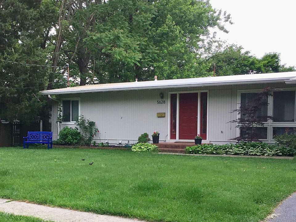 Classic midcentury rambler with large windows, paved driveway with carport, screened-in porch and side car pad, in quaint neighborhood with sidewalks, parks, schools.