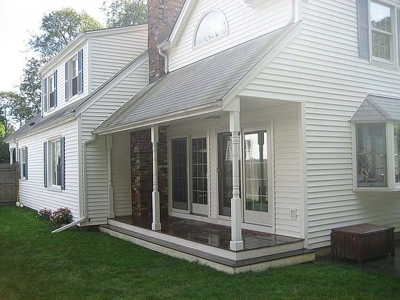 Small side porch with mahogany decking.