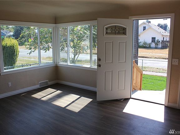 Living room with lots of natural light! New door on the front. New flooring as well! 