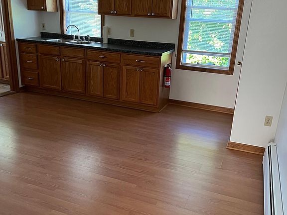 Larger eat-in-kitchen with plenty of cabinets. Bright and sunny. Blinds on both windows.