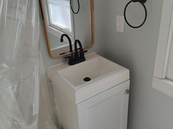 Bathroom; new tile floors, vanity, and fixtures