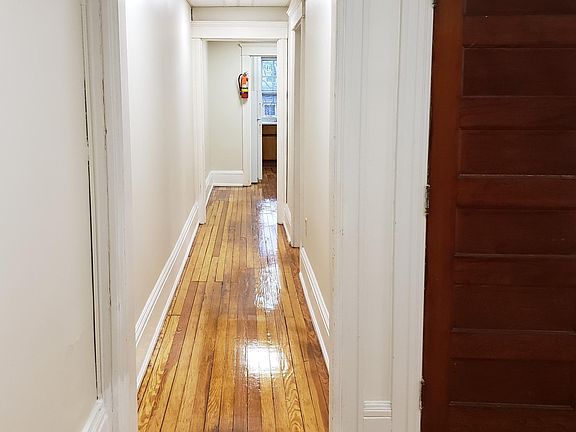 Refinished hardwood throughout.