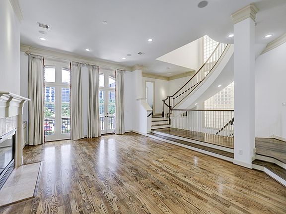 Living room on second floor with access to balcony -view of Kirby