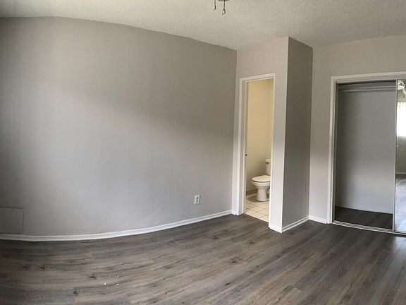 Bedroom #1 with attached half-bathroom.