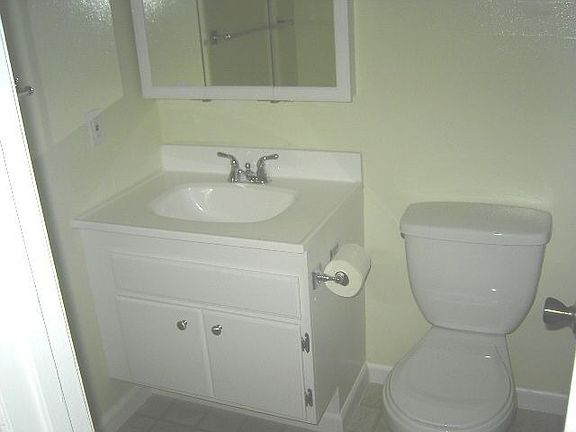 New sinks, fixtures, mirror cabinet, lighting, toilet, floors