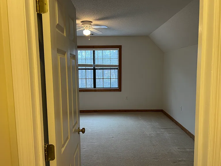 Smaller upstairs bedroom includes:
Queen-sized room
Morning sunlight
Ceiling fan
Dedicated attic storage
Shared upstairs bathroom