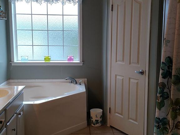 Master bath with garden tub and shower. Has toilet room.