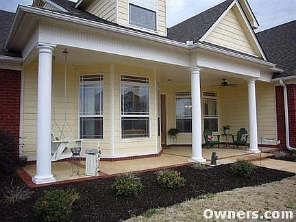 Large front porch with ceiling fan