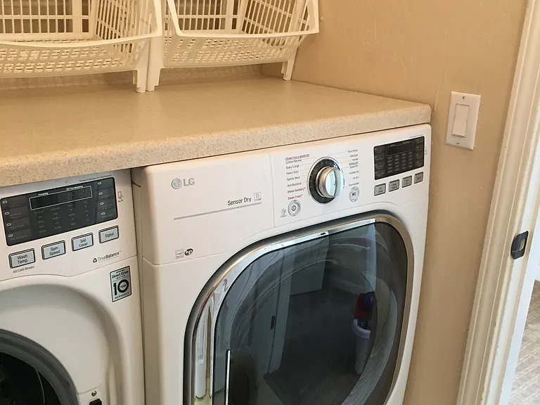 Upstairs laundry room with extra shelving not shown