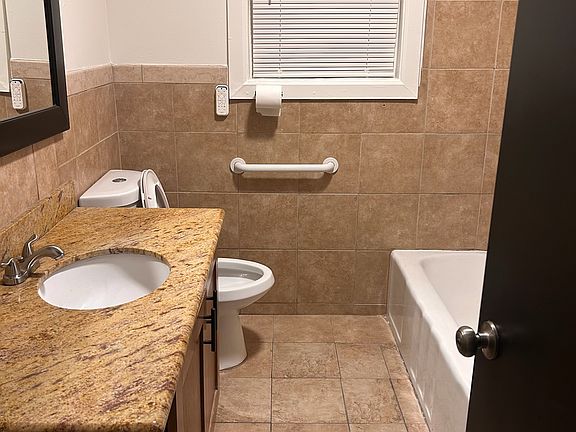 ground floor bathroom one with tub