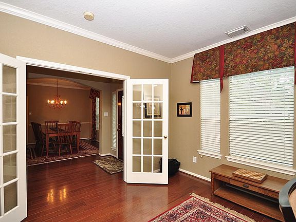 Study with french doors for privacy and wall of windows provides lots of natural light.