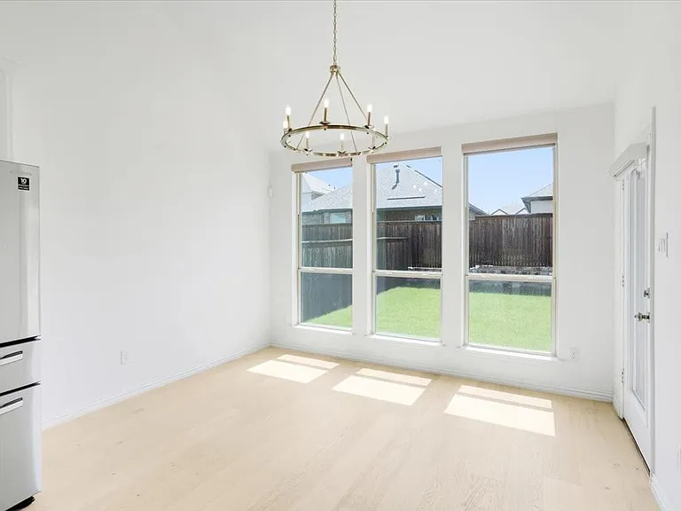 Bright dining area flooded with natural light.