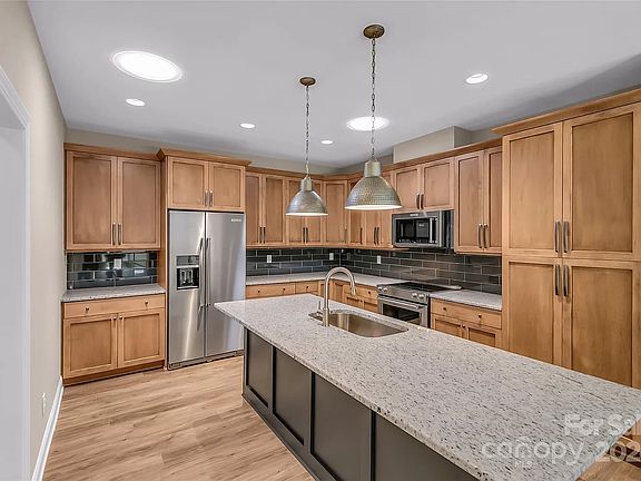 Custom Cabinets, granite countertops, KitchenAid appliances