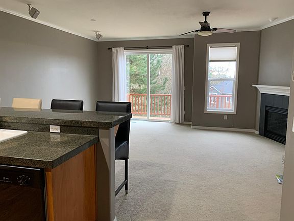 Granite kitchen counter and breakfast bar, chairs included