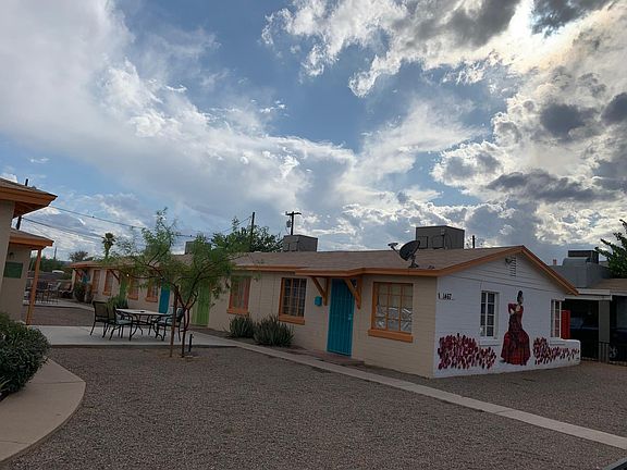 Your building with Apartment a as the blue door to the right. The mural is next to your living room window.