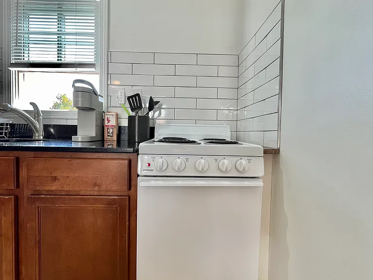 stove and oven, microwave, full fridge and freezer