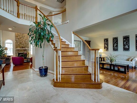 Grand Two Story Entrance with Marble
