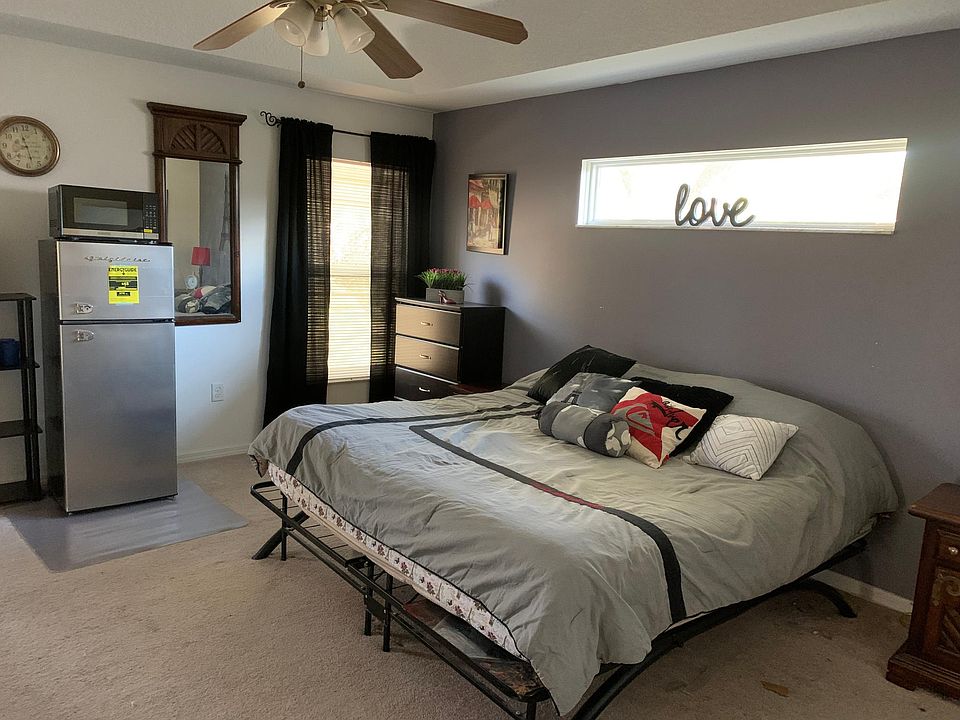 room with fridge and microwave